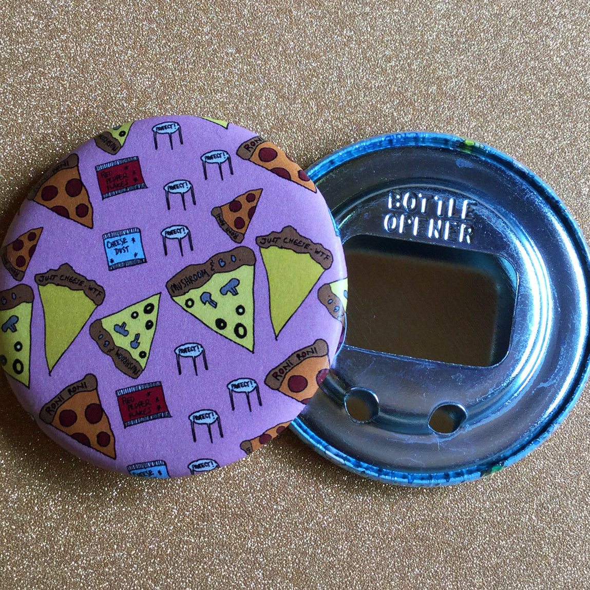 Pink bottle opener with pizza design on a gold surface